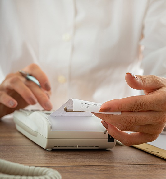 accountant using a calculator